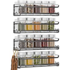 three tiered spice rack with spices and seasonings on the bottom, hanging from hooks