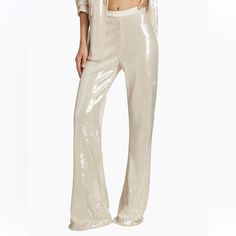 Only Worn Once, Amazing Condition Super Cute Sequin Flared Pants, Great For New Years, Bachelorette, Bridal, Or Disco Ivory White / Cream, Called Alabaster On The Website Fit Me Well And I’m 5’5” Inseam Approx 32”, Waist Approx 14.5”, Waist To Hem Approx 43” I Do Have The Matching Blazer In A Size 2 - Was Going To Hold Onto It But Open To Selling White Straight Pants For Evening, Elegant Beige Party Pants, Elegant Beige Pants For Party, Beige Pants For Spring Evening, White Full-length Evening Pants, Elegant Sequined Wide Leg Pants, Elegant Beige Party Bottoms, Cream Evening Trousers, Chic Cream Pants For Evening