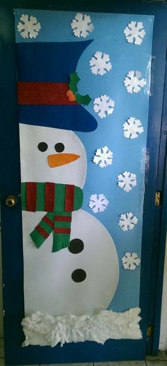 a door decorated with a snowman and scarf