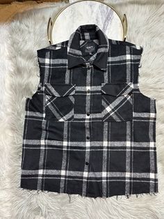 Black white plaid vest oversized Fringe hem Armpit to armpit 23” Length 27” Two chest pockets Black And White Buffalo Plaid Vest, Oversized Black Flannel Top, Oversized Plaid Top With Buttons, Plaid Flannel Top With Button Closure, Retro Plaid Flannel Top, Flannel Vest, Punk Plaid, Vest Womens, Black And White Flannel