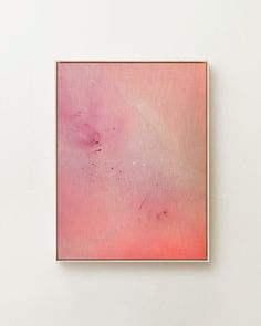 an abstract painting on a white wall with pink and red paint in the middle,