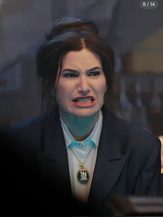 a woman in a suit and necklace with an evil look on her face