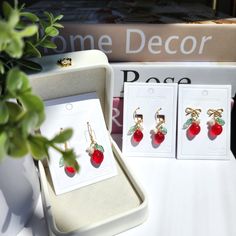 Our mini strawberry fruit dangle earrings are made with Czech glass strawberry, acrylic flower and 14K gold plated earring hooks which are good for delicate ears. We have 925 sterling silver plated version available, please contact seller for details. Size: the hook style(W x L) 0.5" X 1.3" the bow tie style( W x L) 0.6" X 1" the Lever Back style( W x L ) 0.5" X 1.3" the stud style( W x L ) 0.5" X 0.9" Earrings Food, Strawberry Earrings, Glass Drop Earrings, Acrylic Flower, Food Earrings, Fruit Earrings, Strawberry Fruit, Stud Style, Acrylic Flowers