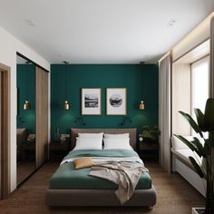 a bedroom with green walls and wooden floors