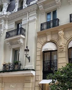 an ornate building with balconies and wrought iron balcony railings