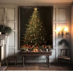 a decorated christmas tree in front of a fireplace