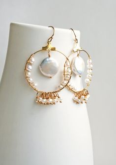 Coin Pearl Earrings, Bohemian Wedding Earrings, Boho Bride, Pearl EarringsIt's all about the round hoops and round pearls in this bohemian bridal earring. Wear on your wedding day and after. Because these will look great for brunch too!+ Coin Pearl. Small pearls. 14K Gold Fill Ear Wire. 14K Gold Fill Hoop.+ Length: 2 inches.+ Width: 1.25 inches at the widest part.+ Earrings are ready to ship.+ Your jewelry will come in a jewelry box, tied with a ribbon.Thanks for looking ♥Check out our other bri Bohemian Wedding Earrings, Pearl Jewelery, Coin Pearl Earrings, Boho Wedding Earrings, Bridal Earring, Furniture Movers, Bohemian Bridal, Pearl Jewellery, Coin Pearls