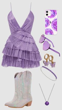 a purple dress and accessories are laid out