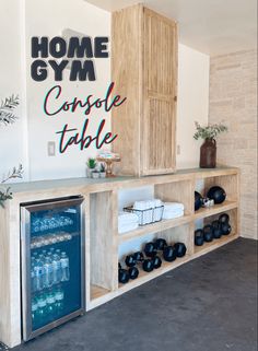 a home gym with an icebox, water cooler and other items on the counter