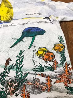 "Brand: UNDER SEA Size: XL Made In Tag Missing Single Stitch 90s FEE SHIPPING Measurements are taken with the garment laying flat. Chest width: 22\" Body Length : 29\" Condition: Pre-owned 8.5/10 Material: 100% Cotton Comment no tear no stian no hole No refund. -Payment : accept paypal only -Shipping : to shipping worldwide by registered airmail (small package) Thai post registered. receiving the item within 7-30 business days non sat-sunday working after payment cleared (some case in Australia/ Vintage Beach Shirt, Vintage Print Beach Shirt, Vintage Beach Shirt With Vintage Print, Vintage Animal Shirt, Vintage Graphic Print Beach T-shirt, Dare Shirt, Granola Girl Outfits, Spring Flower Art