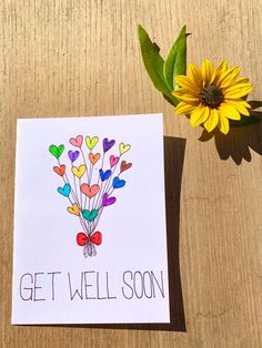 a greeting card that says get well soon next to a sunflower