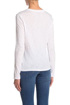 Perfect for styling versatile looks, this long sleeve T-shirt is a wardrobe essential. 23 1/2" length (size Medium) Crewneck Long sleeves Chest patch pocket 100% cotton Machine wash, dry flat Imported Women's Clothing White Fitted Long Sleeve Crew Neck Top, Basic Cotton Long Sleeve Top, Cotton Fitted Top For Fall, White Casual Long Sleeve Top With Graphic Print, Trendy Crew Neck Top For Layering, White Fitted Top T-shirt For Fall, Casual Stretch Top With Shirttail Hem, Everyday Long Sleeve Graphic Tee Tops, Everyday Long Sleeve Graphic Tee