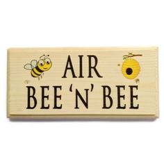 a wooden sign that says air bee'n'be with two bees on it