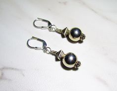 Understated minimalist dangle earrings in sterling silver with a lever back closure and marked 925. The ball is 10mm. One of a Kind. Elizabeth Bennett, Shoulder Duster Earrings, Diamond Ring Settings, Beaded Purses, Vintage Art Deco, Ring Sets, Beautiful Rings, Vintage Art, Swarovski Crystals