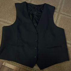 Black Vest Perfect For All Occasions. Never Worn Excellent Condition. Classic Black Office Vest, Black Business Vest For Fall, Black Formal Vest For Fall, Black Fitted Vest For Semi-formal Occasions, Classic Black Vest For Business, Fitted Elegant Black Vest, Elegant Fitted Black Vest, Black Fitted Vest For Formal Occasions, Black Fitted Formal Vest