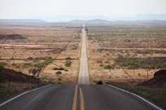 an empty road in the middle of nowhere