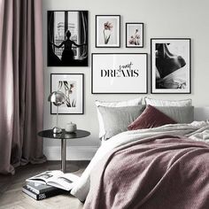 a bedroom with pictures on the wall above the bed and below the bed is a small table