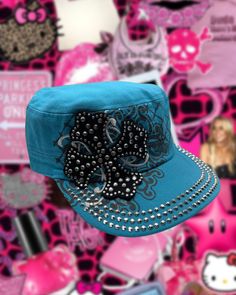 2000s style Rhinestone cross cadet bratz style hat! Size information: ⬇️  * Measured in Adult sizes!  * 22 inches around the crown. * Velcro adjustable in the back (see all photos for reference) Add some early 2000s flair to your wardrobe with this cadet hat in light blue! With a blingy cross design and a colorful range of options, this cadet style cap is sure to make a statement. (But in a cool way, not in a "trying too hard" way, ya know?) Limited stock, so grab yours now! ♡ hi, thank you so much for supporting my Y2K shop! I want to bring nostalgia and happiness to everyone who shops with me! Nostalgia was always an escape from negativity for me, as well as causing me extreme happiness and I want to help others feel the same kind of happiness I feel from it! NO RETURNS / NO REFUNDS UNLE 2000s Hat, Y2k Blue Aesthetic, Y2k Cap, Y2k Hats, Trashy Y2k Aesthetic, Y2k Hat, Rhinestone Denim, French Hat, Aesthetic 2000s