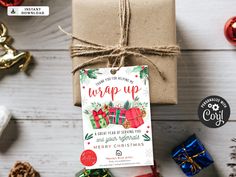 a wrapped up christmas gift sitting on top of a wooden table next to other presents