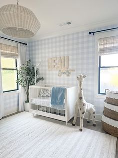 a baby's room with blue and white checkered walls