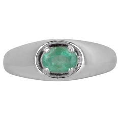 A dapper natural emerald oval cut solitaire ring. This exquisite piece features a gorgeous oval-cut emerald from the mines of Zambia. The gemstone showcases a beautiful shine, mossy medium green color, and good luster. Four-prong set in a shiny sterling silver setting. Setting Style: Prong Setting Material: Sterling Silver .925 Main Stone: Emerald Shape: Oval Cut Weight: 0.80-Carats Clarity: Semi-Transparent Color: Medium Green Luster: Good Treatments: Natural, Oiling Origin: Zambia Estimated Re Semi Transparent, Sterling Silver Rings Bands, Silver Band Ring, Zambia, Natural Emerald, Oval Cut, Sterling Silver Bands, Solitaire Ring, Silver Band