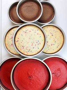 six tins filled with different types of cakes