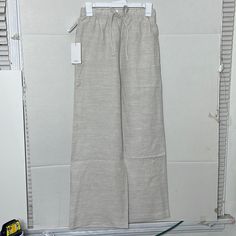 These Are High-Rise Wide-Leg Pants With An Elastic Waist And Drawcord. They’re Cut From Soft, Drapey Fabric Made With Linen And Tencel Lyocell Responsibly Sourced Wood-Based Fibres Produced Through A Closed-Loop System That Reduces Environmental Impact. Materials & Care Content: 66% Tencel Lyocell, 34% Linen Care: Machine Wash Imported Rise: High Leg: Wider Length: Full Intended To Hit At The Ground While Wearing Flat Shoes A Size L Will Fit Someone Who Typically Wears A 12 In Other Aritzia Clot Linen Loungewear Pants Full Length, Beige Linen Wide Leg Pants For Daywear, Summer Beige Wide Leg Daywear Pants, Beige Wide Leg Pants For Summer Daywear, Neutral Linen Bottoms For Daywear, Full Length Cream Pants For Summer, Cream Full Length Summer Pants, Casual Off White Wide Leg Pants For Spring, Casual Cream Linen Wide Leg Pants