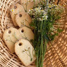 some flowers and cookies in a wicker basket