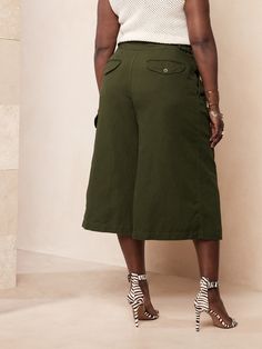 Evoke an adventuresome spirit, this explorer pant mixes utilitarian details with a high-rise-silhouette and flowing, wide-leg for feminine appeal.  Finished with a sturdy double-belted closure, these culottes make an easy choice for warm-weather days Versatile Belted Wide Leg Pants, Utility Wide-leg Parachute Pants With Belt Loops, Utility Paperbag Waist Bottoms For Workwear, Khaki Belted Bottoms For Work, Utility Style Paperbag Waist Bottoms For Workwear, Spring Versatile Wide Leg Cargo Pants, Versatile Spring Cargo Style Wide Leg Pants, Spring Utility Wide Leg Pants For Workwear, Spring Utility Wide Leg Work Pants