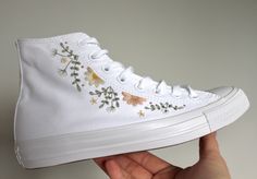 A pair of all white Converse canvas high tops embroidered with sprigs of eucalyptus, gypsophila and daisies.  You can either choose to have the outside leg (along eyelet seam), inside leg (wreath around badge) or both.  Please let me know if you'd like slightly different colour flowers or threads - these can be swapped to suit your desired colour palette of required.  Please ensure when selecting your size it is the correct one - you are responsible for ensuring you have selected the correct siz Platform Converse High Tops, Converse Platform High Top, All White Converse, Personalized Converse, Embroidered Converse, Cute Converse, Converse Platform, Dr Shoes, Preppy Shoes