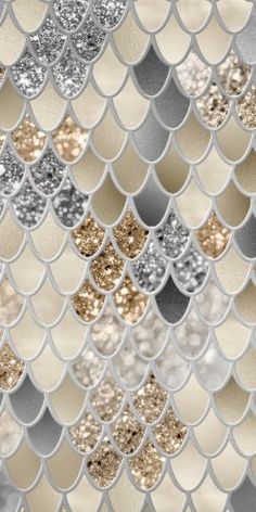 an abstract background with silver, gold and white fish scale scales on it's surface