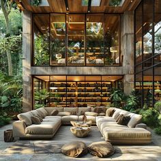 a living room filled with lots of furniture next to a tall glass wall covered in plants