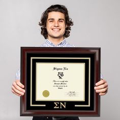 static image of smiling male college graduate holding a Sigma Nu Church Hill Classics diploma frame University Graduation Gifts, Self Care Items, College Grad Gifts, Graduation Gifts For Him, University Graduation, College Graduate, College Graduation Gifts, Frame Matting