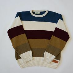 A STEP FORWARD FOR THE HOMELESS The world isn't always black and white, so why should your sweaters be? Introducing the Technicolor Striped Sweater, perfect for the most colorful hippies. This flat knit sweater is made in Binghamton, New York out of recycled tshirt trimmings and features a vegan leather patch. The blue, burgundy, olive, and ochre striped crew neck sweater is equally as comfortable as it is good for the environment. As always, every product sold creates employment for a young per Binghamton New York, Recycled T Shirts, Leather Stamps, Trendy Sweaters, Three Sisters, Sweater For Women, Striped Sweater, Leather Patches, Cinnamon Rolls