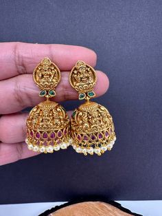 Matte Goddess Lakshmi Nakshi Jhumka Earrings Very pretty gold look alike Earrings Length : 1.75 Inches; Weight : 13 grams each Ready to ship from Boston, MA Temple Jewelry, Earrings Indian, Traditional Earrings, Green Stones, Goddess Lakshmi, Indian Earrings, Jhumka Earrings, Temple Jewellery, Boston Ma