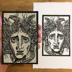 two handmade cards with faces on them, one is black and the other is white