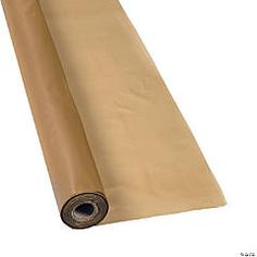 a roll of brown paper sitting on top of a white surface