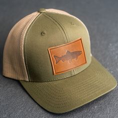 Wear your new Leather Patch Trucker Style Hat out fishing or anywhere! All hats ship for free within the USA! SPECS *Leather Patch Color Options: Natural Dublin (Light) or Nut Brown Dublin (Dark) *Hat Color Options: Choose from Navy/White, Charcoal, or Green/Khaki *All of our products are made to order by hand in McKinney, TX MATERIALS *REAL HORWEEN LEATHER: Premium Full-Grain Leather. oEach patch is one-of-a-kind and made from part of a whole hide of leather. There will be unique variation from Khaki Fishing Cap, Khaki Cap For Fishing, Adjustable Green Hats For Fishing, Brown Curved Brim Trucker Hat For Fishing, Adjustable Flat Brim Trucker Hat For Fishing, Green Curved Brim Hat For Fishing, Green Fishing Cap, Adjustable Trucker Hat For Fishing, Brown Trucker Hat With Short Brim For Outdoor Activities