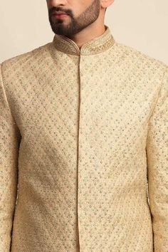 Golden sherwani with dori work embroidered motifs. Paired with front button placket kurta and straight-cut pant.
Component: 3
Pattern: Embroidered
Type Of Work: Dori work
Neckline: Mandarin collar
Sleeve Type: Full sleeves
Fabric: Raw Silk, Silk, Crepe
Color: Gold
Other Details: 
Side slits
Embroidered motifs
Front button placket
Occasion: Wedding - Aza Fashions Dori Work, Kurta Set For Men, Straight Cut Pants, Kurta Set, Full Sleeves, Embroidered Silk, Raw Silk, Mandarin Collar, Straight Cut