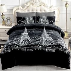 black and white bedding with the eiffel tower on it