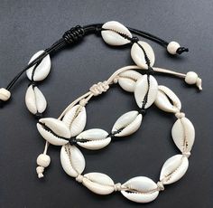 Looking for a stylish and distinctive shell conch bracelet? Try our Bohemian shell conch bracelet instead! The elegance of beach-inspired jewellery is combined with the charm of Boho style in this handcrafted masterpiece. This elaborately braided design created by the pearls and shells evokes the serenity of ocean waves and the spirit of summer.  This bracelet epitomizes unisex style and coastal charm, whether strolling down the beach or adding a touch of beachy beauty to your everyday outfit. W Seashell Bracelet, Knit Bracelet, Rope Jewelry, Bohemian Accessories, Shell Bracelet, Foot Jewelry, Shell Jewelry, String Bracelet, Strand Bracelet