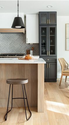 two stools are in front of the kitchen island