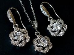 Wedding Cubic Zirconia Camellia Silver Earrings Necklace Jewelry Set with .925 Sterling Silver Chain. CHAIN is 18 inches (45.7 cm) long, PENDANT is about 1 inch (2.5cm) long including bail. EARRINGS are about 1.22 inch (3.1cm) long from top of earring wire to bottom. BRIDAL EARRINGS SECTION: https://www.etsy.com/shop/LanaChayka?ref=seller-platform-mcnav§ion_id=11638940 BRIDAL JEWELRY SETS SECTION: https://www.etsy.com/shop/LanaChayka?ref=seller-platform-mcnav§ion_id=25839214 BRIDAL NECKLACES SEC Champagne Jewelry, Earrings Zirconia, Bridal Necklaces, Wedding Halo, Pearl Bracelet Wedding, Blue Crystal Necklace, Wedding Jewelry Set, Earring Wire, Prom Jewelry