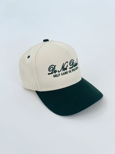 a white and green baseball cap with the words dr no shave on it's side