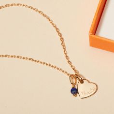 Our Personalized Mini Gemstone Heart Necklace is a touch of love for those that fill your heart with joy. The perfect personalized gift for a new mum, each necklace features a colorful gemstone to pair alongside a heart charm, hand-engraved with the name and birth date of their new arrival.&nbsp;Please note that there may be slight variations between each gemstone due to its origins.18K Champagne Gold Plated or 925 Sterling SilverMini Flat Heart: 0.4 x 0.4Mini Gemstone: 0.15 x 0.15 x 0.1Secure clasp fasteningCharms are removable from this chain and can be worn on all Merci Maman chain lengthsHand-engraved in our Paris workshopSent with love in a complimentary gift boxPlease note that necklaces that have several charms may develop a certain patina, giving it a unique style.Any slight va Personalized Heart-shaped Birthstone Necklace As A Gift, Heart-shaped Birthstone Necklace For Her, Heart Cut Birthstone Necklace For Keepsake, Personalized Heart-shaped Birthstone Necklace As A Gift For Her, Personalized Heart-shaped Birthstone Necklace, Personalized Heart Pendant Charm Necklace With Birthstone, Heart-shaped Birthstone Charm Necklaces For Mom, Personalized Birthstone Charm Necklace With Heart Pendant, Birthstone Charm Necklace With Heart Pendant