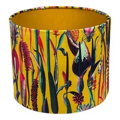 a lampshade with an image of plants and flowers printed on it, in yellow