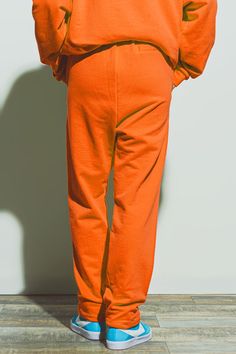 Meet our Oversized Jogger with Tie Waist in Bright Orange, a vibrant and comfy addition to your wardrobe. These joggers feature a relaxed fit, straight legs, functional pockets, a tie fastening, and an elasticated drawstring waist. The fabric is made from 100% Cotton. These joggers are made in Italy. The model is 5'10" with measurements of 32-23-25. One size fits all. Types Of Jeans, Style Sport, Pants Fit, Online Fashion Boutique, Modern Trend, Perfect Wardrobe, Made Clothing, Fashion Joggers, Cute Sets