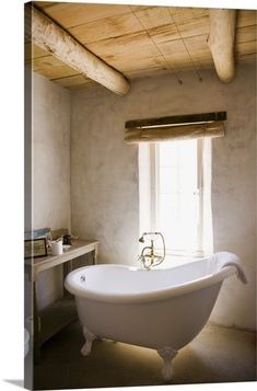 an old fashioned bathtub in a rustic bathroom