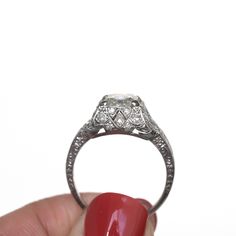 *VIEW A VIDEO OF THIS RING* https://youtu.be/KAfWFamWlWM This ring can be sized up or down 4 sizes for an additional $40. If you wish to have a ring sized please purchase the item and note the size in the message section. Ring Size: 7 Metal Type: Platinum [Hallmarked, and Tested] Weight: 5.4 grams Center Diamond Details: GIA REPORT # 6204639065 Weight: 1.49ct Cut: Antique Asscher Color: K Clarity: VS1 Side Diamond Details: Weight: .20cttw Cut: Antique Single Cut Color: G Clarity: VS Finger to To Art Deco Halo Ring With Round Cut, Art Deco Platinum Halo Ring With Center Stone, Gia Certified Cushion Cut Heirloom Jewelry, Heirloom Cushion Cut Gia Certified Jewelry, Heirloom Cushion Cut Diamond Ring With Vvs Clarity, Classic Platinum Halo Ring With Diamond Cut, Antique Platinum Rings With Vvs Clarity, Antique White Gold Gia Certified Diamond Ring, Antique Platinum Round Cut Cluster Ring