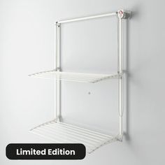 a white wall mounted shelf with two shelves on each side and the words limited edition above it